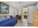 Bedroom and en-suite bathroom with mirrored closet doors at 239 Hill St # 239, Casselberry, FL 32707
