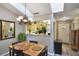 Dining room with seating for four, view to kitchen, and front door visible at 239 Hill St # 239, Casselberry, FL 32707