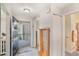 Welcoming foyer with a decorative entry door, a glass display cabinet, and access to the bathroom at 239 Hill St # 239, Casselberry, FL 32707