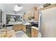 Bright kitchen featuring stainless steel appliances, ample cabinet space, and a convenient layout at 239 Hill St # 239, Casselberry, FL 32707