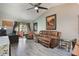 Cozy living room boasts a ceiling fan, comfortable seating, and access to the patio at 239 Hill St # 239, Casselberry, FL 32707