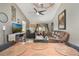 Inviting living room featuring a leather sofa, fan, and view to outdoor patio at 239 Hill St # 239, Casselberry, FL 32707
