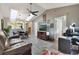 Living space featuring skylights, tv, and an open concept flow into dining and kitchen area at 239 Hill St # 239, Casselberry, FL 32707