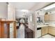 Inviting living space featuring hardwood floors, natural light, and views of kitchen and entryway at 239 Hill St # 239, Casselberry, FL 32707