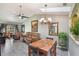 Open-plan space with a table, vaulted ceiling, skylight, fan, and comfortable leather sofa at 239 Hill St # 239, Casselberry, FL 32707