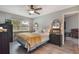 Relaxing bedroom with dark wood furniture, ceiling fan and plenty of natural light at 239 Hill St # 239, Casselberry, FL 32707