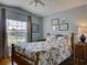 Cozy bedroom with natural light, window, and traditional furnishings creating a comfortable atmosphere at 25307 La Grange Ct, Leesburg, FL 34748