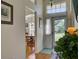 Inviting foyer with hardwood floors, a view into the dining area, and ample natural light at 25307 La Grange Ct, Leesburg, FL 34748