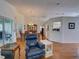 Spacious living area with a dining area, hardwood floors, and a view of the adjoining kitchen at 25307 La Grange Ct, Leesburg, FL 34748