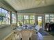 Inviting sunroom with plenty of windows, offering abundant natural light, seating and scenic views at 25307 La Grange Ct, Leesburg, FL 34748