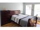 Comfortable bedroom with natural light, dresser, and a modern bed frame at 2812 Club Cortile Cir # A, Kissimmee, FL 34746