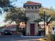 The community features a grand entrance with a guard house, clock tower, and decorative landscaping at 2812 Club Cortile Cir # A, Kissimmee, FL 34746