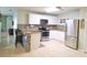 Modern kitchen with stainless steel appliances, ample counter space, and stylish breakfast bar at 2812 Club Cortile Cir # A, Kissimmee, FL 34746