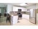 Well-lit kitchen with stainless steel appliances, stylish backsplash, and counter seating at 2812 Club Cortile Cir # A, Kissimmee, FL 34746
