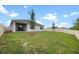Well-maintained backyard features an outdoor patio, green grass and a vinyl fence at 2900 Sunridge Loop, St Cloud, FL 34771