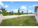 A spacious backyard featuring a lush green lawn and a secure white fence at 2900 Sunridge Loop, St Cloud, FL 34771