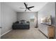 Neutral bedroom featuring a ceiling fan, carpet and comfortable daybed at 2900 Sunridge Loop, St Cloud, FL 34771