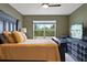 Comfortable bedroom with large window that provides natural light and views of the backyard at 2900 Sunridge Loop, St Cloud, FL 34771