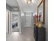 Open foyer featuring tile floors, decorative mirror, console table, and an open view to the bedroom at 2900 Sunridge Loop, St Cloud, FL 34771