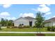 Well-maintained single-story home with green lawn and landscaped front yard, offering great curb appeal at 2900 Sunridge Loop, St Cloud, FL 34771