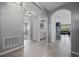 Spacious hallway with tile flooring leading to the laundry room, living area, and bedrooms at 2900 Sunridge Loop, St Cloud, FL 34771