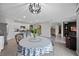 Bright eat-in kitchen with stainless appliances, breakfast bar, and dining nook overlooking the living area at 2900 Sunridge Loop, St Cloud, FL 34771