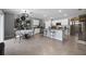 Open-concept kitchen features white cabinetry, granite countertops, stainless steel appliances, and a cozy breakfast nook at 2900 Sunridge Loop, St Cloud, FL 34771