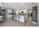 Bright, open kitchen features a kitchen island with bar seating and stainless steel appliances at 2900 Sunridge Loop, St Cloud, FL 34771