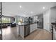 Open-concept kitchen featuring a kitchen island, stainless steel appliances, and tile flooring at 2900 Sunridge Loop, St Cloud, FL 34771