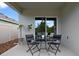 Cozy outdoor patio featuring a small table with seating, and shade to relax at 2900 Sunridge Loop, St Cloud, FL 34771