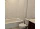 Standard bathtub, toilet, and a small portion of the vanity in a bright bathroom at 2980 Embark Trail, St Cloud, FL 34771
