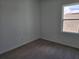 Bedroom featuring a new carpet flooring, a large window for great sunlight at 2980 Embark Trail, St Cloud, FL 34771