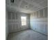 Bright bedroom with unfinished walls, concrete floor, and a window offering natural light at 2980 Embark Trail, St Cloud, FL 34771