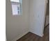 Cozy bedroom featuring a window, hardwood flooring, baseboards, and neutral paint at 2980 Embark Trail, St Cloud, FL 34771