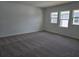 Spacious bedroom with plush carpeting and bright natural light from multiple windows at 2980 Embark Trail, St Cloud, FL 34771