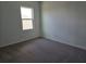 Cozy bedroom filled with sunlight and featuring new carpet flooring at 2980 Embark Trail, St Cloud, FL 34771