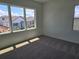Bedroom with large windows offer neighborhood views and new carpet flooring at 2980 Embark Trail, St Cloud, FL 34771