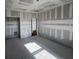 Unfinished bedroom with two doors and natural light at 2980 Embark Trail, St Cloud, FL 34771