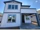 Modern two-story home with gray trim, large windows, and covered front porch, ready for personalization at 2980 Embark Trail, St Cloud, FL 34771