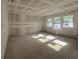 Bright living room featuring unfinished walls, concrete floor, and multiple windows for abundant natural light at 2980 Embark Trail, St Cloud, FL 34771