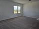Living room featuring plush carpeting and a bright window at 2980 Embark Trail, St Cloud, FL 34771