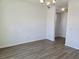 Bright living room features hardwood floors, neutral walls, and modern chandelier at 2980 Embark Trail, St Cloud, FL 34771