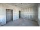 Large living room with unfinished walls and concrete floor, ready to be transformed into your dream space at 2980 Embark Trail, St Cloud, FL 34771