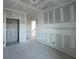Spacious living room featuring unfinished walls and concrete floor, perfect for customization at 2980 Embark Trail, St Cloud, FL 34771