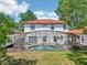 Charming backyard with a screened-in pool and lush green lawn at 332 Summer Place Loop, Clermont, FL 34714