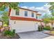 Charming two-story home with a tile roof, two-car garage, and well-maintained landscaping at 332 Summer Place Loop, Clermont, FL 34714