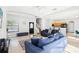 Spacious living room featuring tile floors, comfortable seating, and direct access to the kitchen and stairs at 332 Summer Place Loop, Clermont, FL 34714
