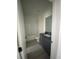 Clean bathroom featuring a toilet, vanity with dark countertops, and shower at 3432 Tranquil Trl, Kissimmee, FL 34747