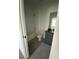 Neat bathroom with toilet, tub, shower, dark vanity and large mirror at 3432 Tranquil Trl, Kissimmee, FL 34747