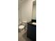 Well-lit bathroom with vanity, toilet, shower, and granite countertop at 3432 Tranquil Trl, Kissimmee, FL 34747